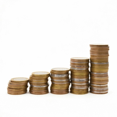 A growing stack of coins and banknotes, symbolizing an emergency fund, on a clean background, no text, no words, no typography, 8K